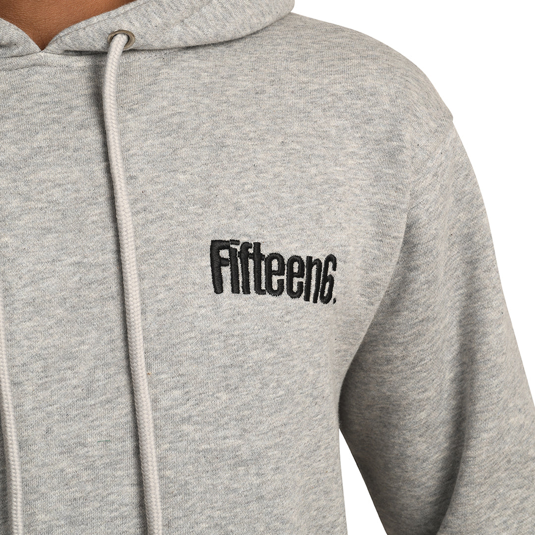 Close-up of a grey Fifteen6 hoodie featuring embroidered logo on the chest, designed as gym wear for comfort and style.